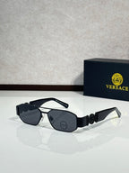 Sunglasses with silver-and-black frame and dark lenses, ornate logo detail on temple