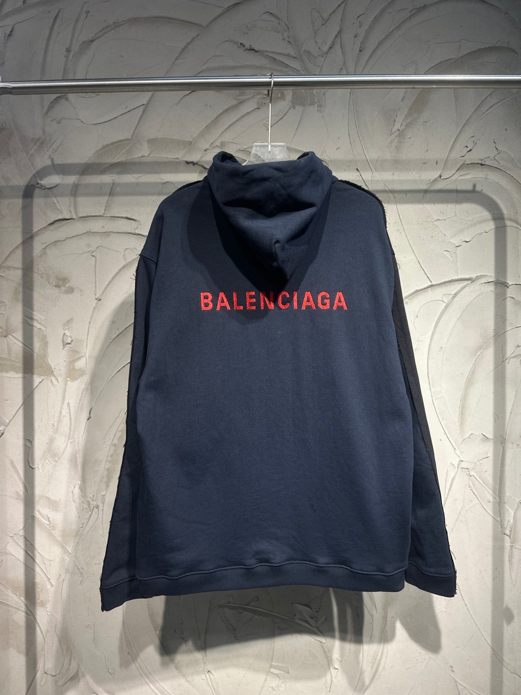 Dark denim hooded jacket with Balenciaga logo text on back