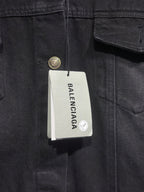Balenciaga-branded size tag on dark denim hooded jacket