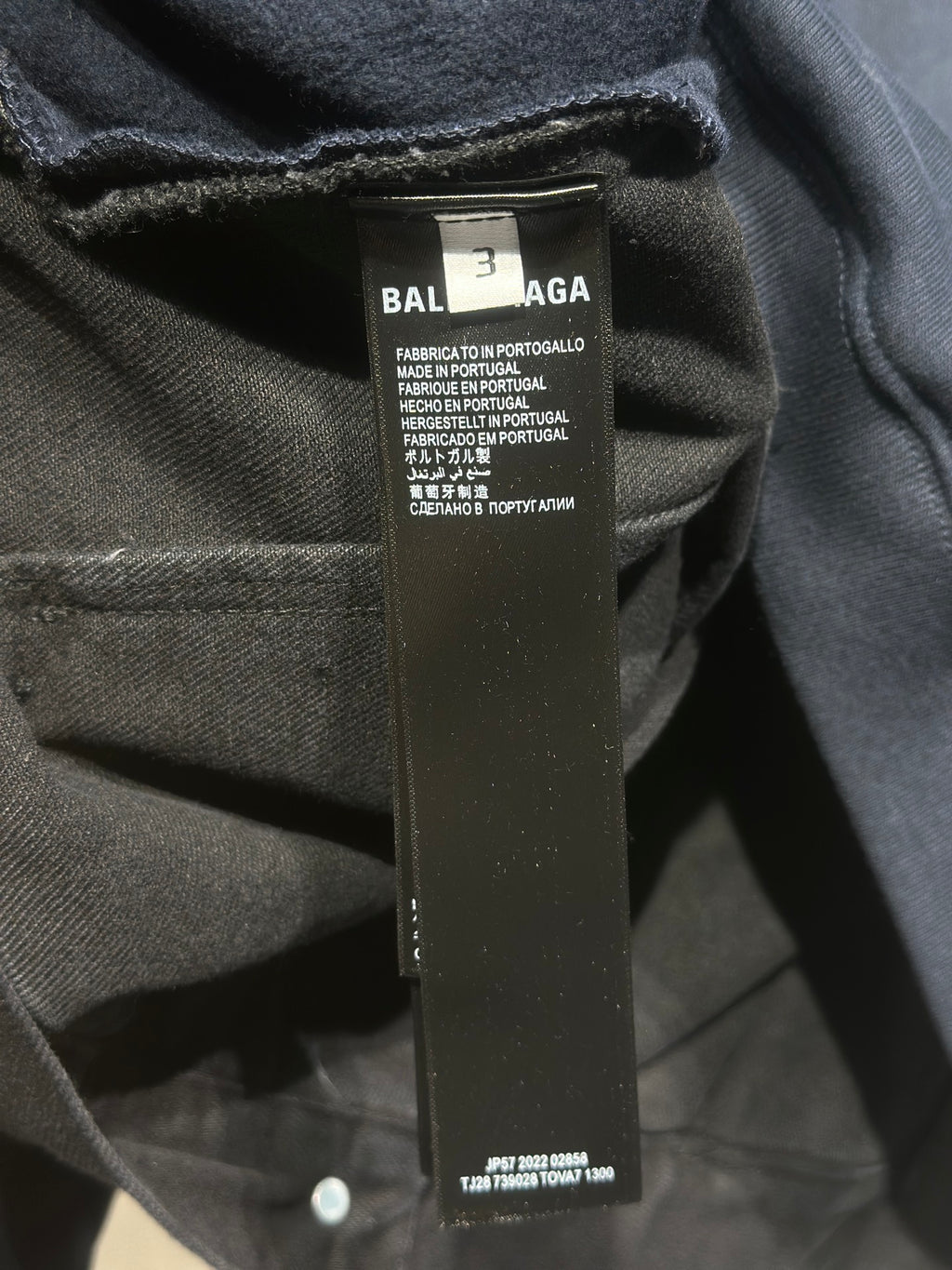 Balenciaga logo size label on dark denim top