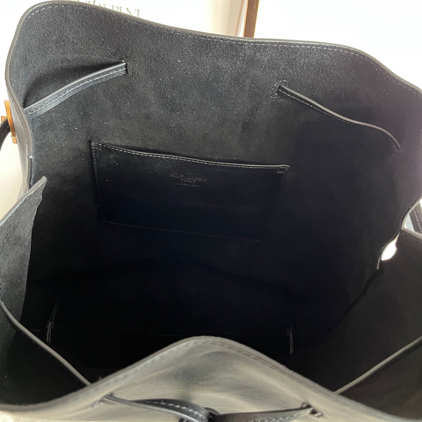 YSL black leather bag interior with front pocket and visible lining