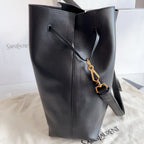 YSL black leather bucket bag with diagonal strap and gold clasp charm