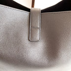 YSL black leather bag top opening with stitched vertical tab detail