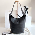 YSL black leather hobo tote bag with front center strap and hanging YSL charm