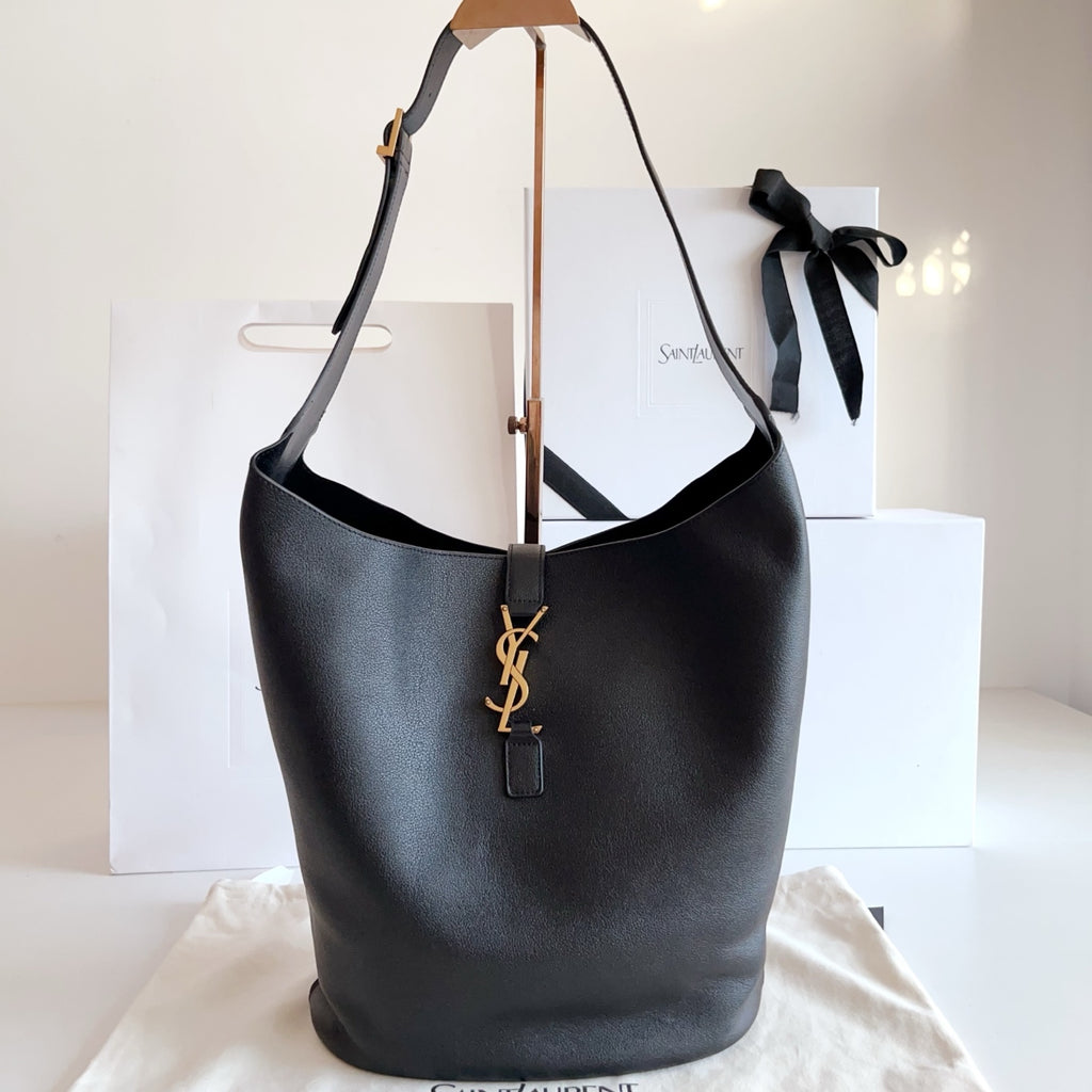 YSL black leather hobo tote bag with YSL logo charm and leather handles
