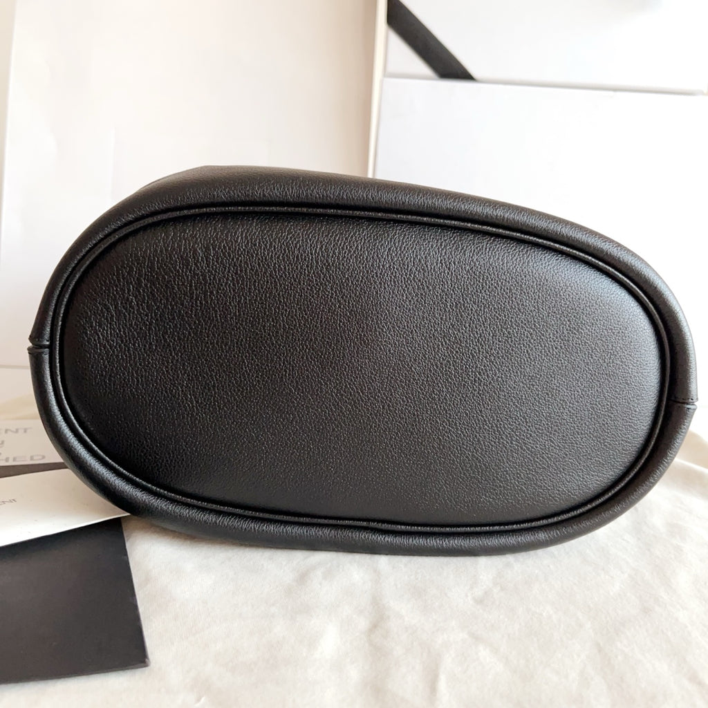 YSL black leather oval mini bag, smooth exterior with rounded top edge