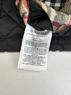 Quilted jacket interior with Burberry fabric care label and stitched trim