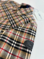 Burberry plaid long-sleeve shirt with round-button cuff detail, close-up