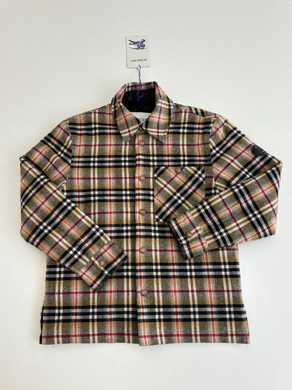 Burberry plaid shirt with two chest pockets and button placket, front close-up