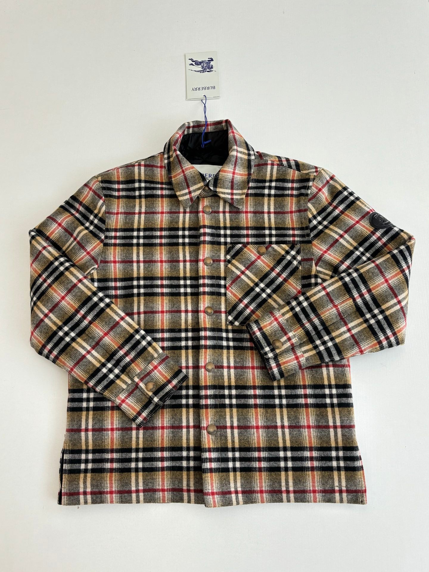 Burberry plaid shirt with two chest pockets and button placket, front close-up