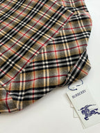 Burberry plaid long coat with buttoned front and rounded collar, tags attached