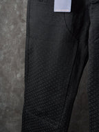 Louis Vuitton pants side view showing textured fabric panel and seam details