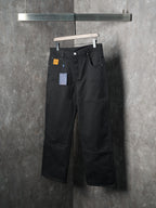 Louis Vuitton pants, dark black, angled view showing belt loops and wide leg silhouette