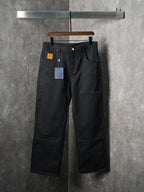 Louis Vuitton pants in dark black with belt loops, button waist, and wide straight legs