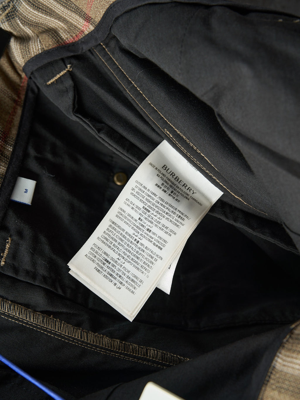 Burberry pants interior with care label and gold-tone trim