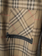 Burberry plaid pants with zippered pocket and black fabric flap
