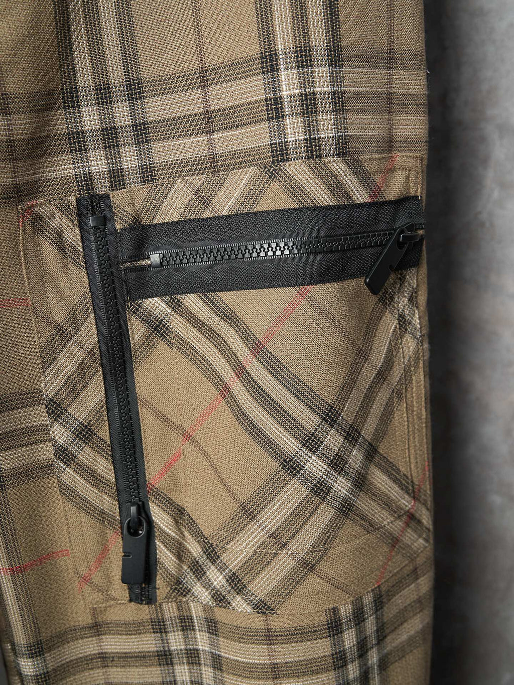 Burberry plaid pants with zippered thigh pocket and black trim
