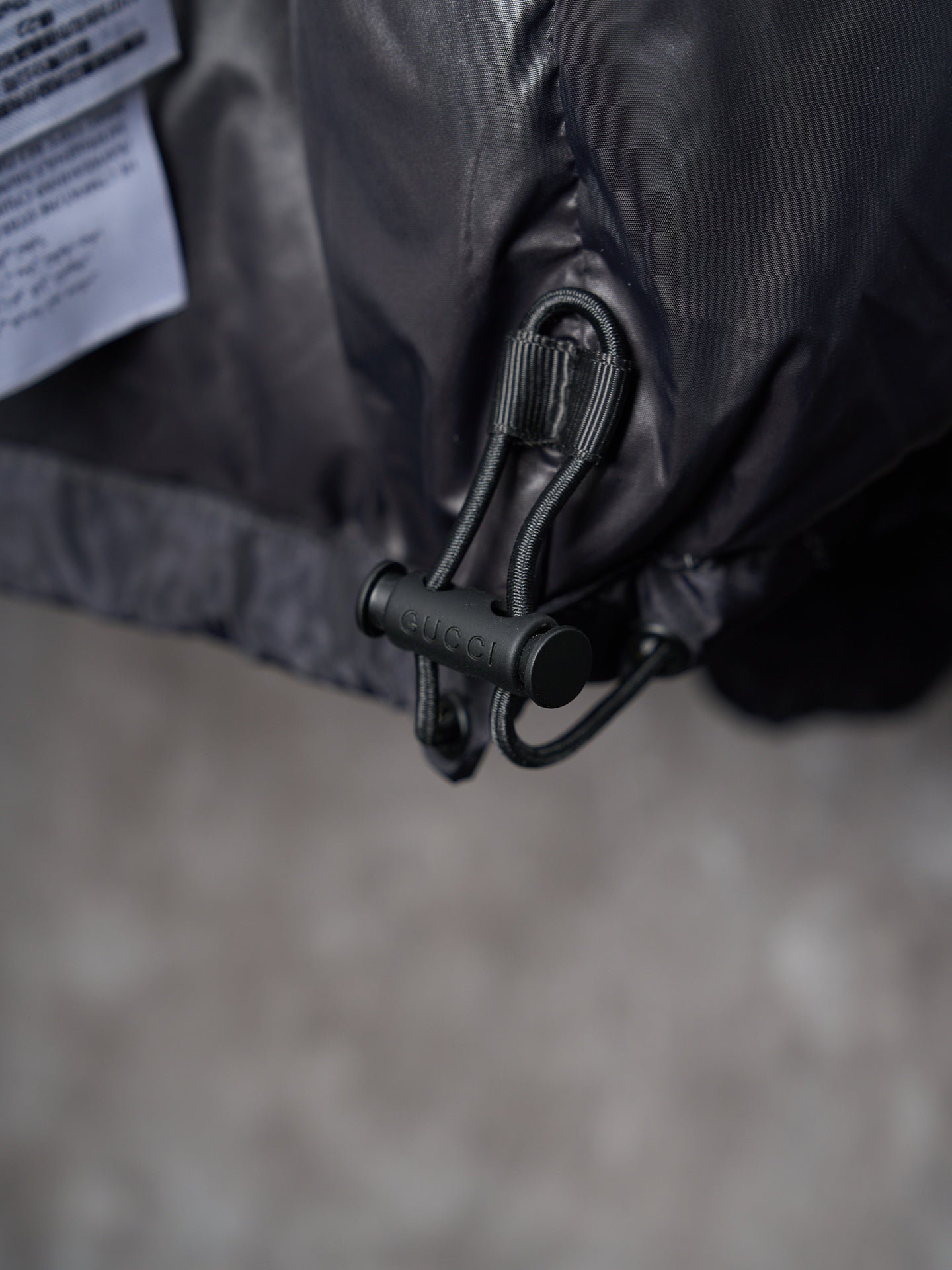 Gucci long jacket drawcord with metal toggle and zipper