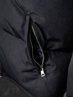 Gucci puffer jacket close-up of center front zipper, dark gray