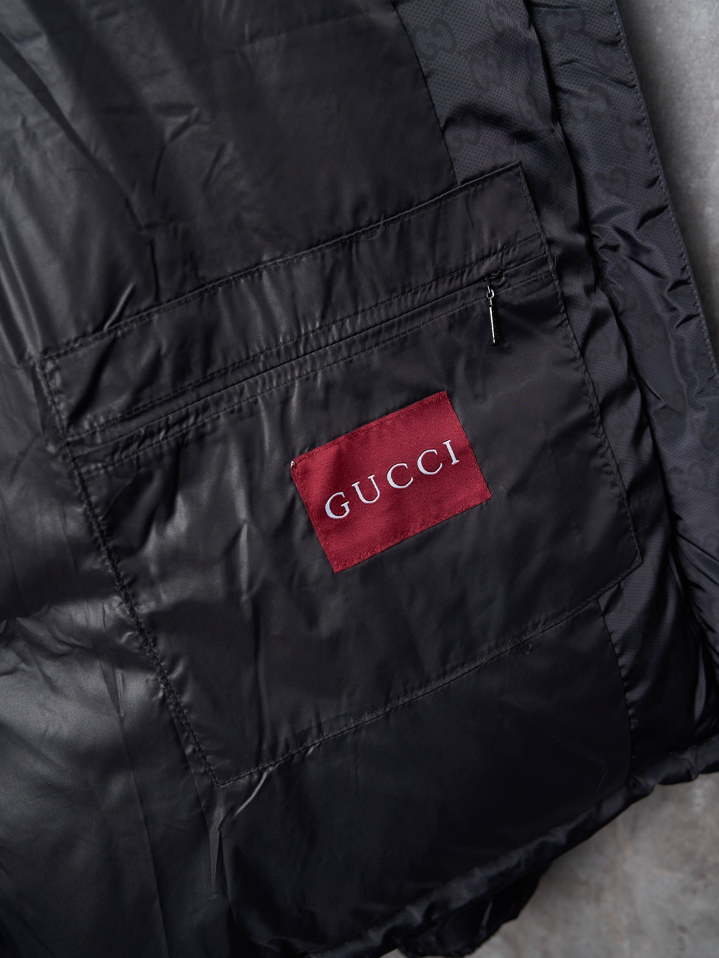 Gucci long jacket with red GUCCI logo patch and front zipper