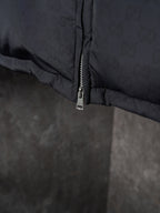 Gucci puffer jacket close-up of lower zipper seam, dark gray
