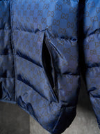 Blue monogram puffer jacket close-up of front side zipper and pocket seam