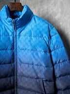 Blue monogram puffer jacket with front zipper and high collar on hanger