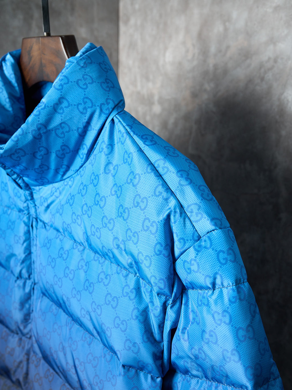 Blue monogram puffer jacket shoulder and hood detail with quilted padding