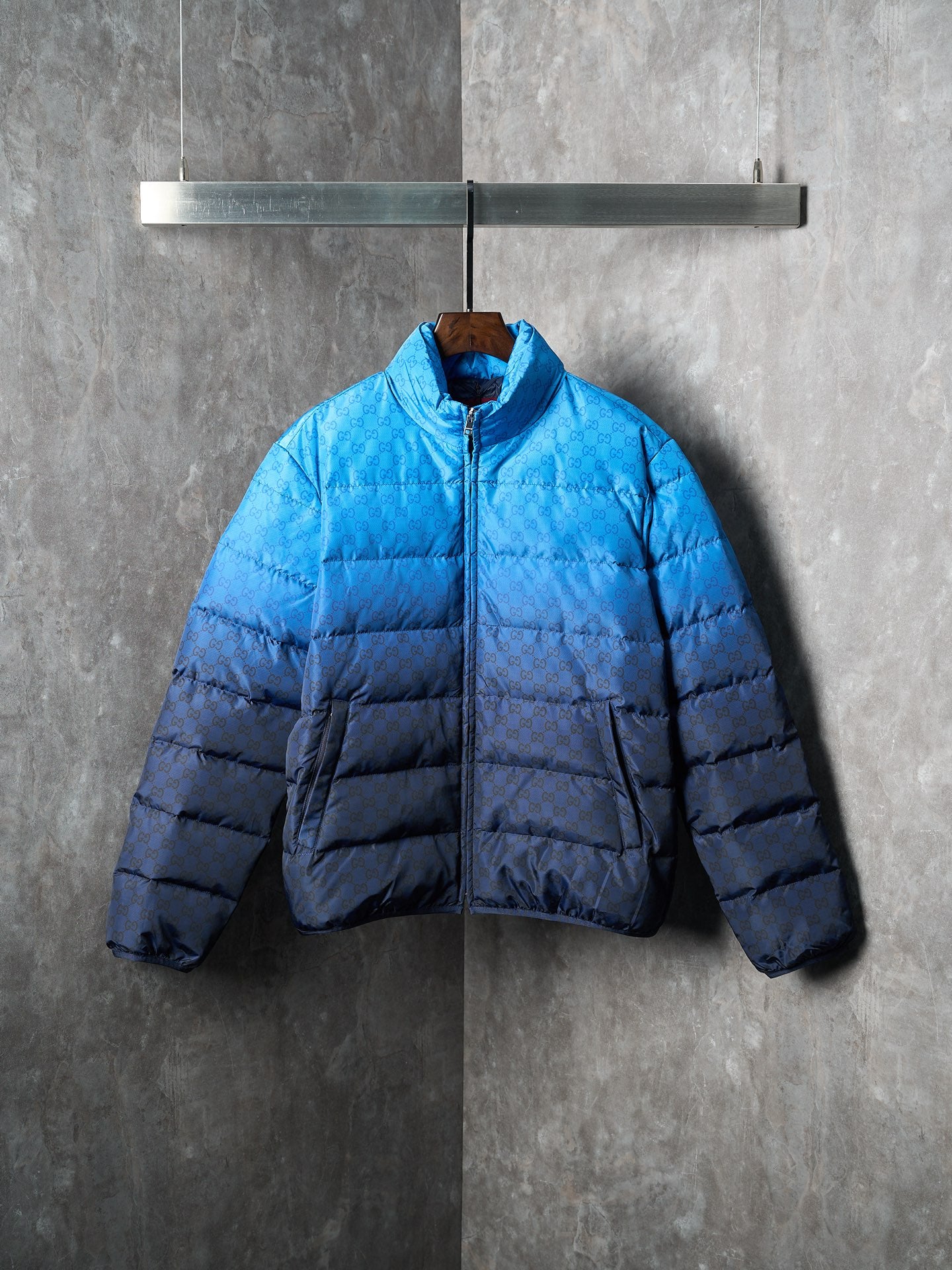 Blue and dark blue puffer jacket with full front zipper and standing collar