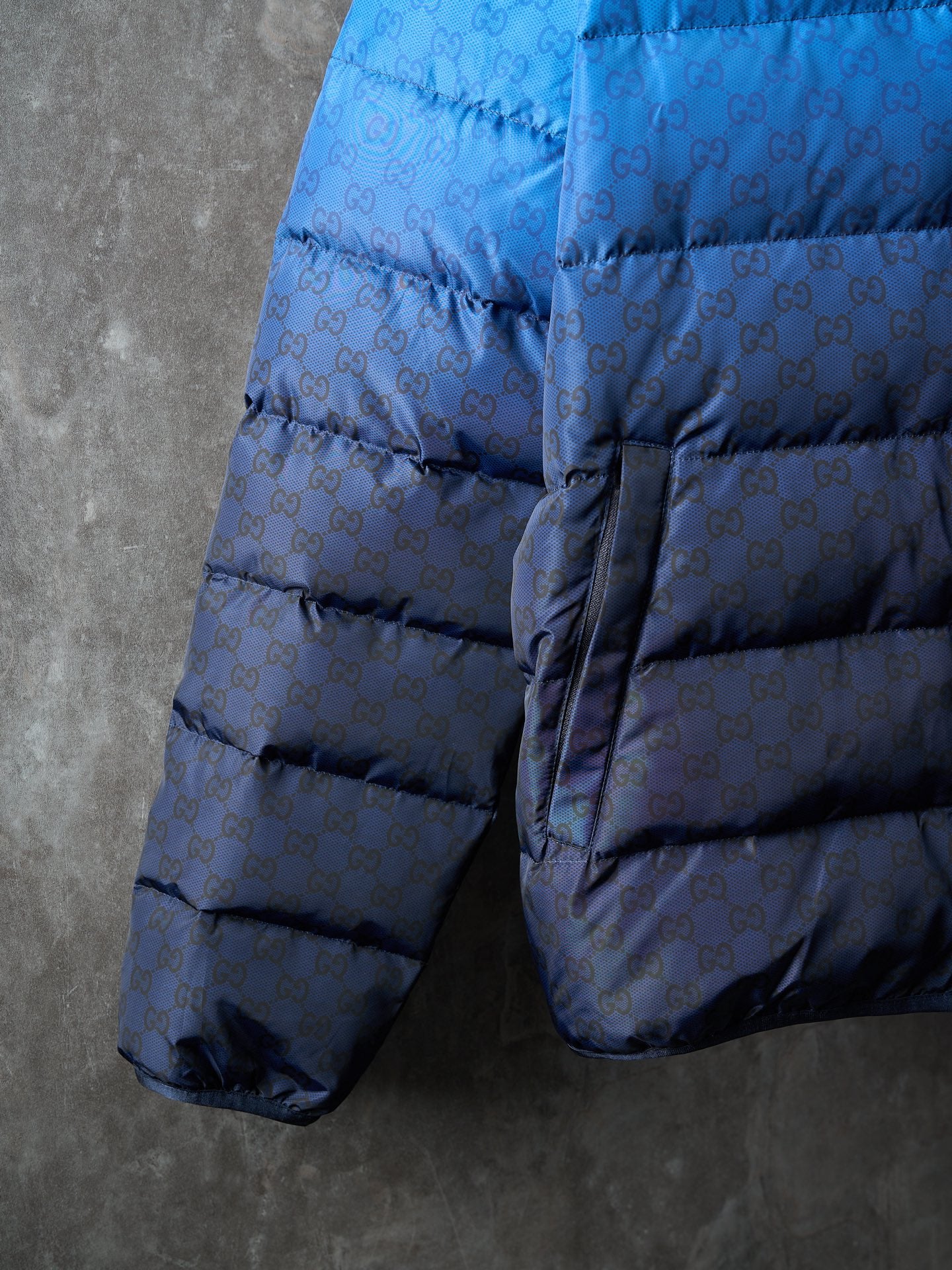 Gucci blue puffer jacket with elastic cuffs and drawstring hem