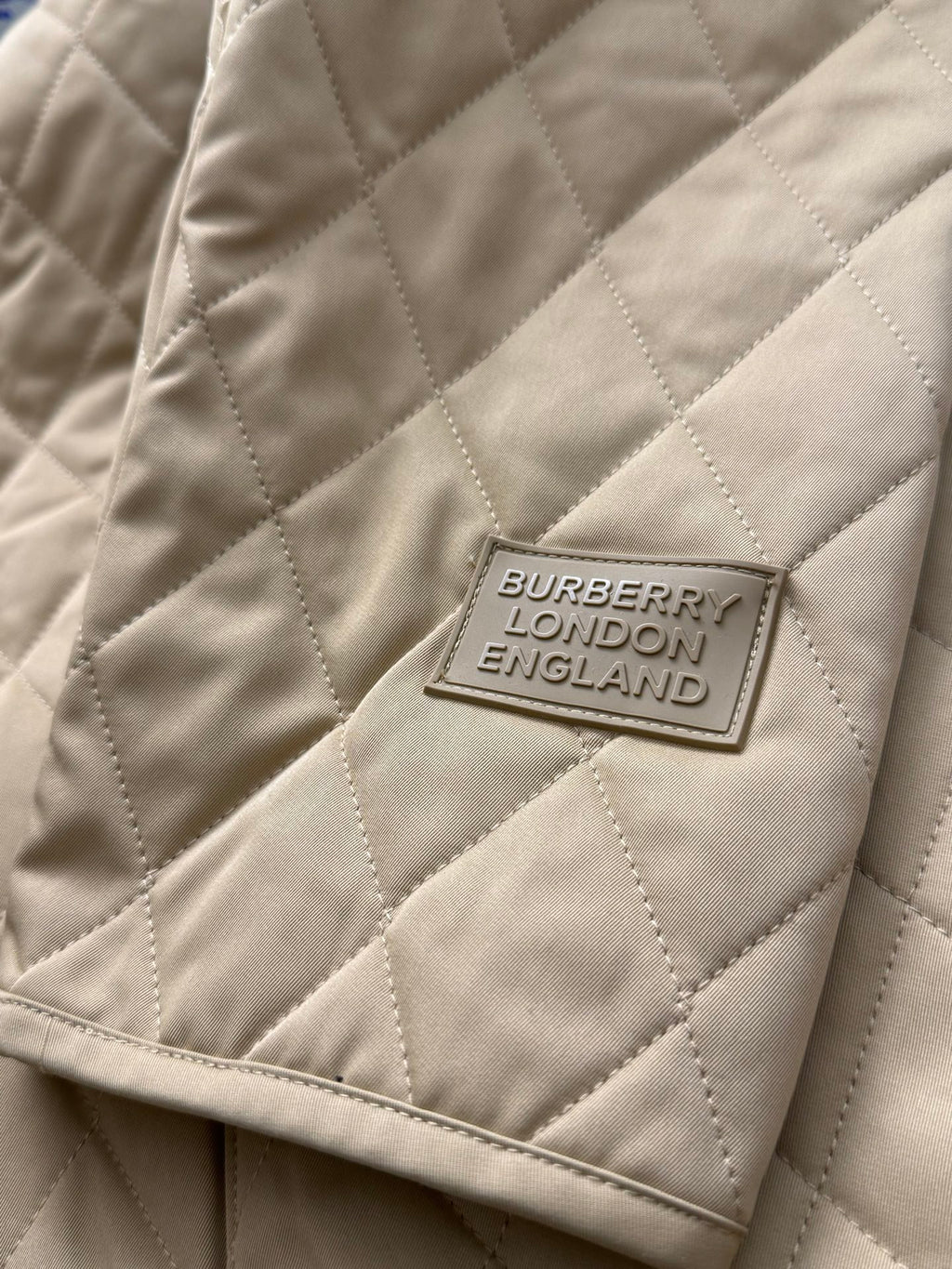 Tan quilted jacket with Burberry London England label patch