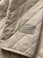 Tan quilted jacket with Burberry London England label patch