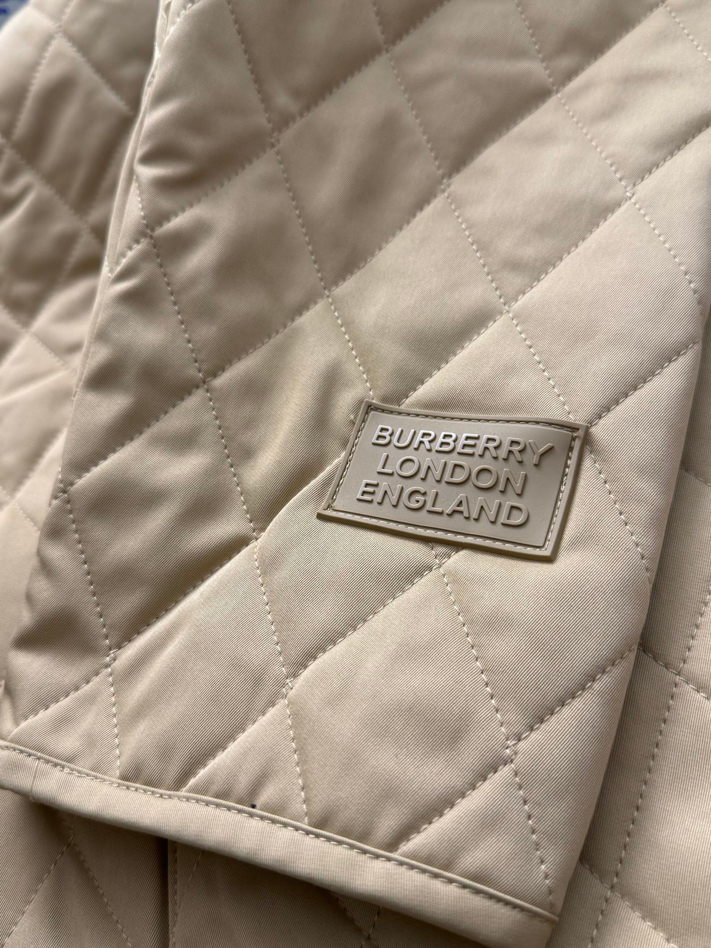 Tan quilted jacket with Burberry London England label patch