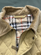 Light yellow quilted jacket lining with plaid hood trim and zipper