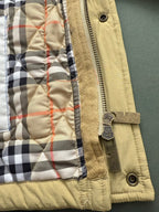 Light yellow quilted jacket cuff with zipper and plaid inner lining