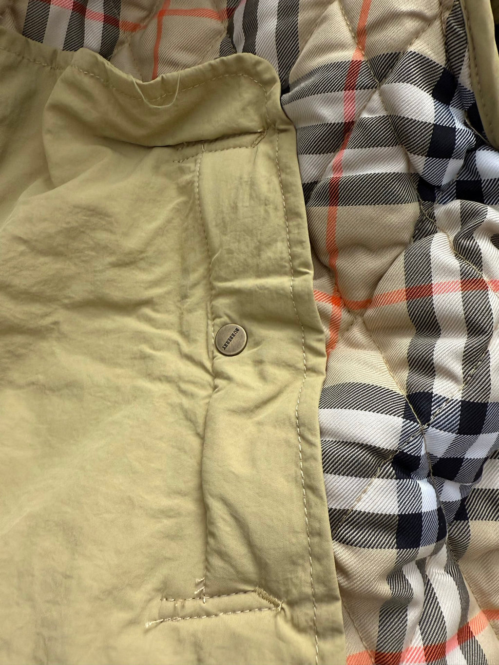 Light yellow hooded quilted lining with beige fabric and plaid interior
