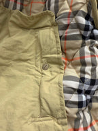 Light yellow hooded quilted lining with beige fabric and plaid interior