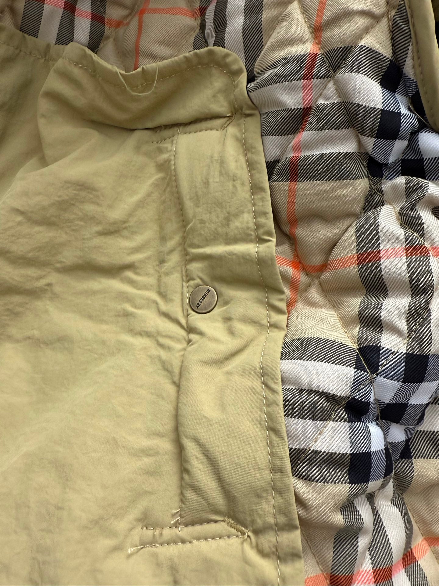 Light yellow hooded quilted lining with beige fabric and plaid interior