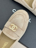 Beige suede loafer vamp with gold-tone rhinestone CC brooch detail