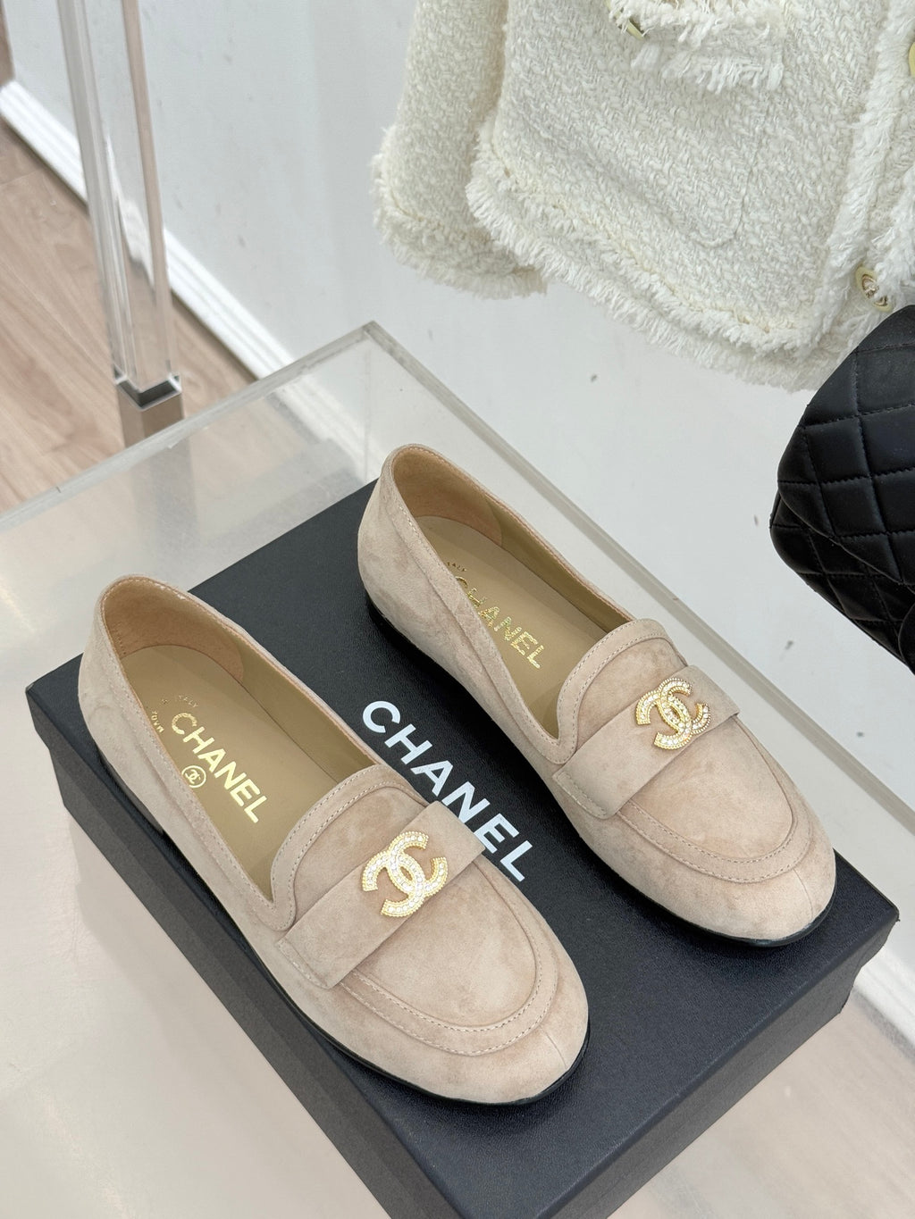 Beige suede loafer shoes with gold-tone CC logo and CHANEL lettering inside