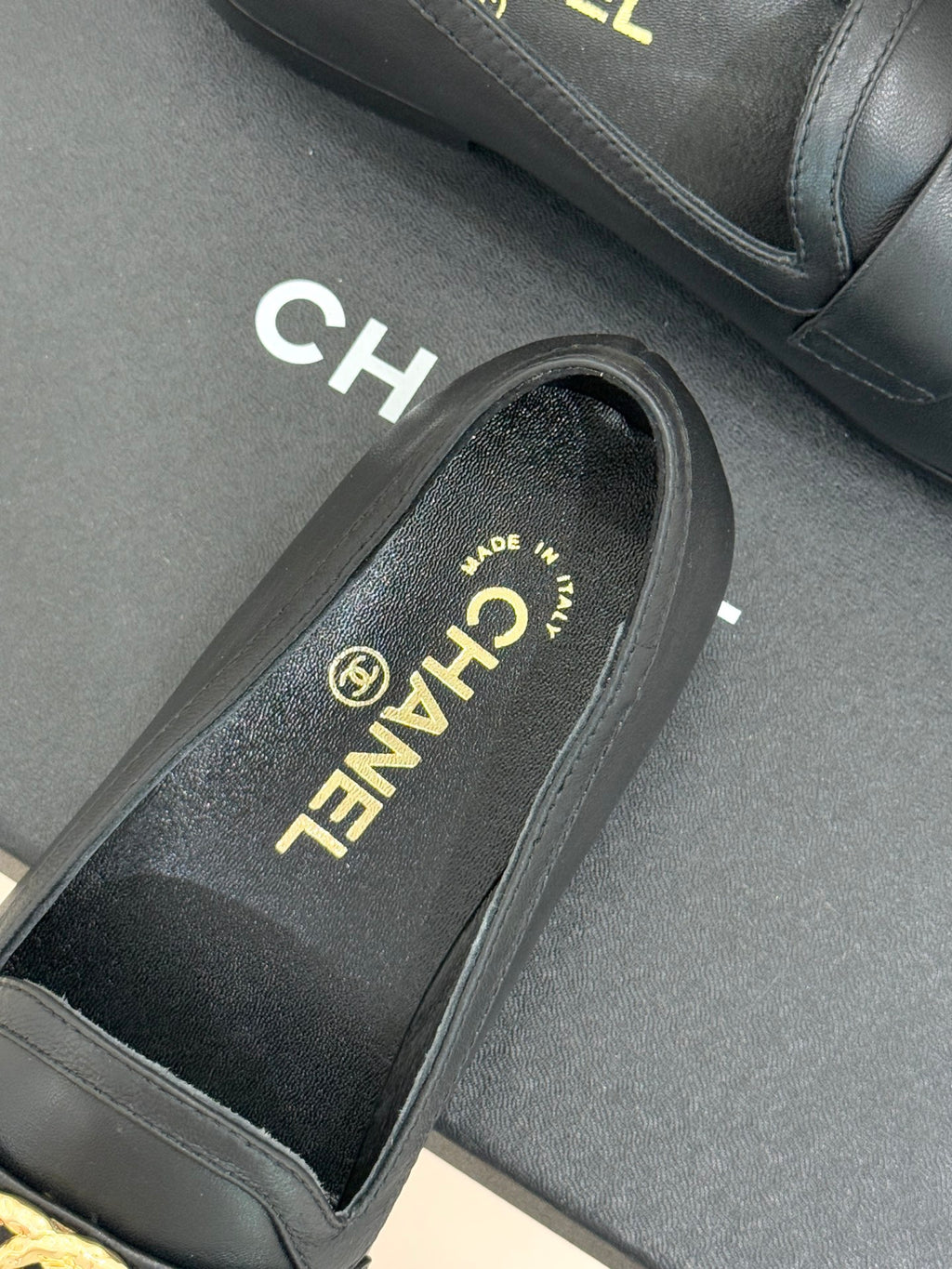 Chanel women’s black loafer close-up showing insole text and side edge