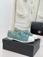 Chanel ladies blue suede sneakers with white rubber toe, teal laces, gold chain trim