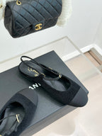 Chanel ladies black slingback flats with gold CC charm and textured mesh upper