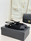 Chanel ladies black fabric slingback flats with gold CC charm and bow detail