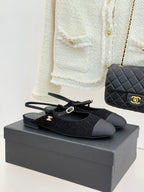 Chanel ladies black fabric slingback flats with gold CC charm and bow detail