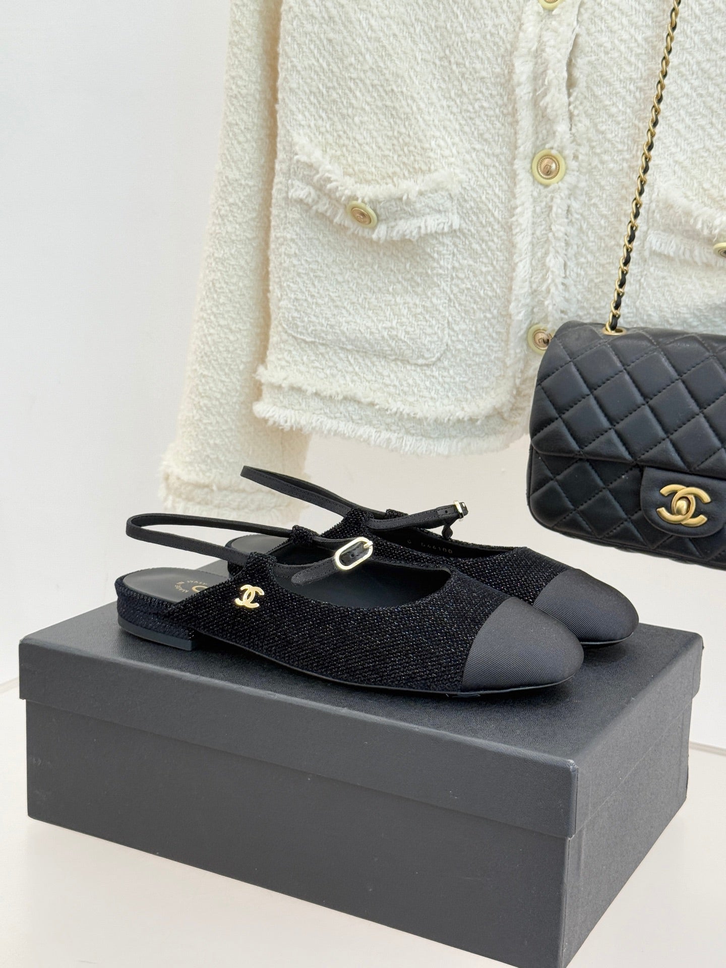 Chanel ladies black fabric slingback flats with gold CC charm and bow detail
