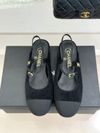 Chanel ladies black fabric slingback flats with gold CC hardware and bow strap