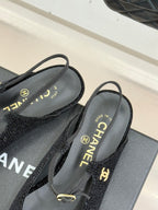 Chanel ladies black slingback flats with 'MADE IN' label and gold hardware