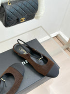 Chanel flats, brown textured upper with dark navy sole and gold CC charm on toe