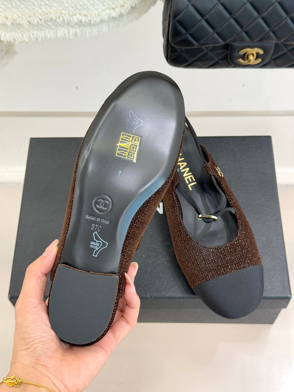 Chanel flat shoes, brown textured upper with navy outsole and gold CC logo on heel